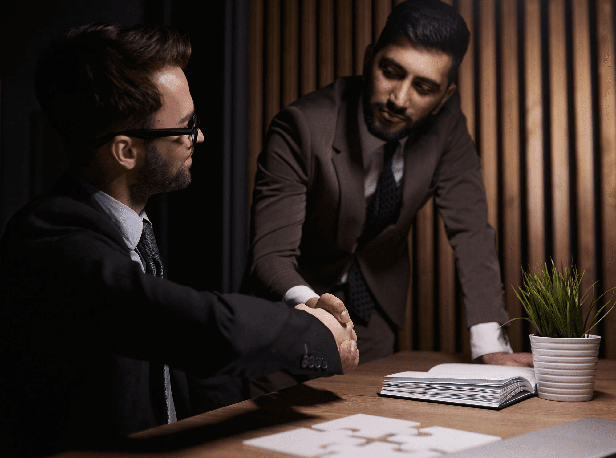 Business professionals reviewing a laptop